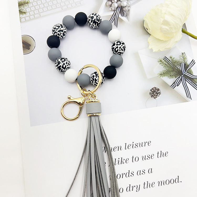 Wholesale Leopard Print White Bottom Wooden Beads Rubber Paint Round Beads PU Tassel Bracelet Keychain